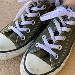 Green low top converse sneakers